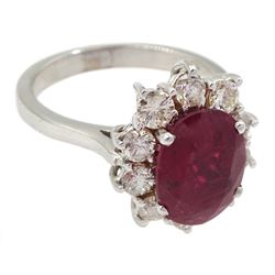 18ct white gold oval Thai ruby and round brilliant cut diamond cluster ring, hallmarked, ruby approx 3.10 carat, total diamond weight approx 0.95 carat