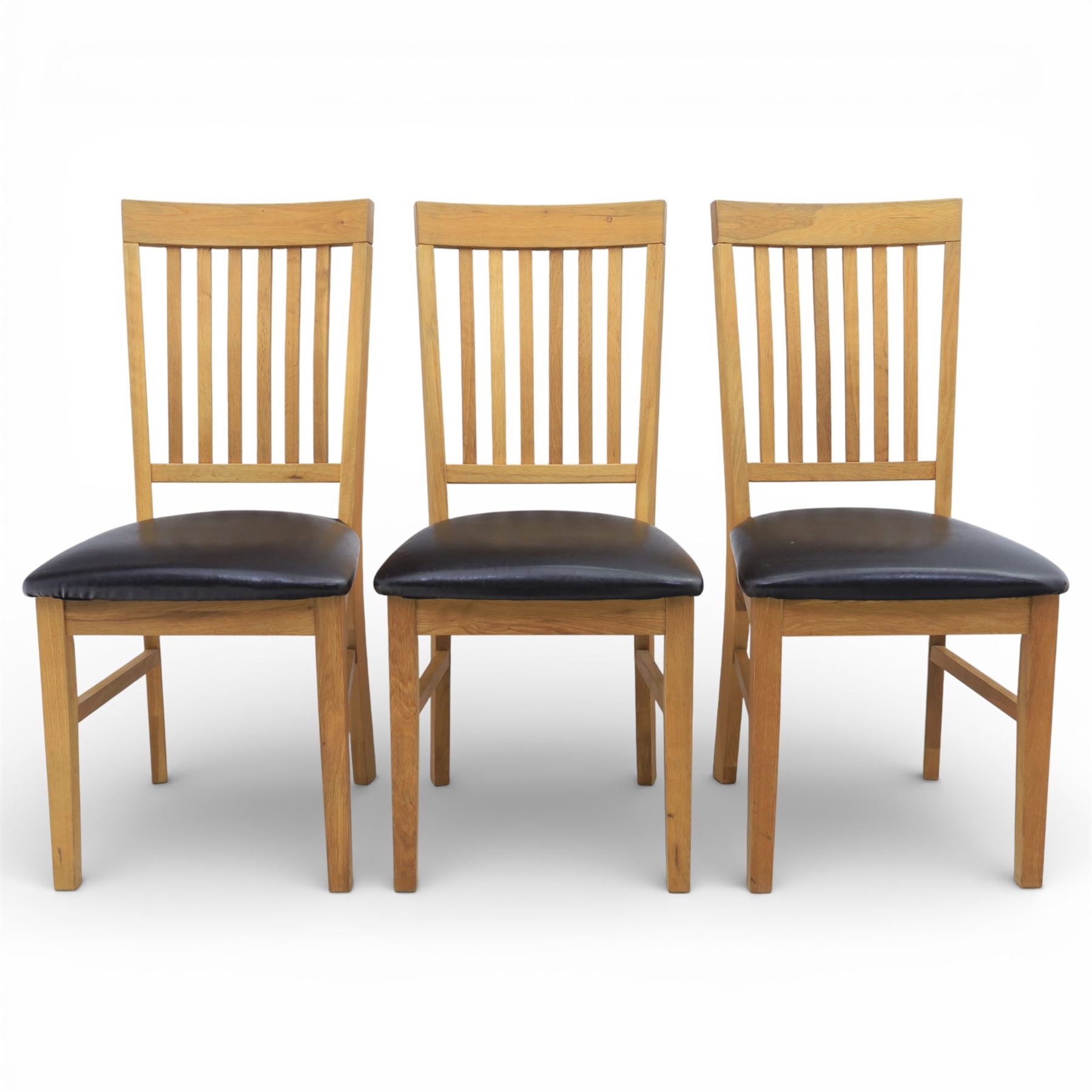 Solid light oak extending dining table with single leaf, and set of six chairs