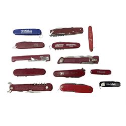Thirteen pocket knives including Swiss Army knives and other similar examples