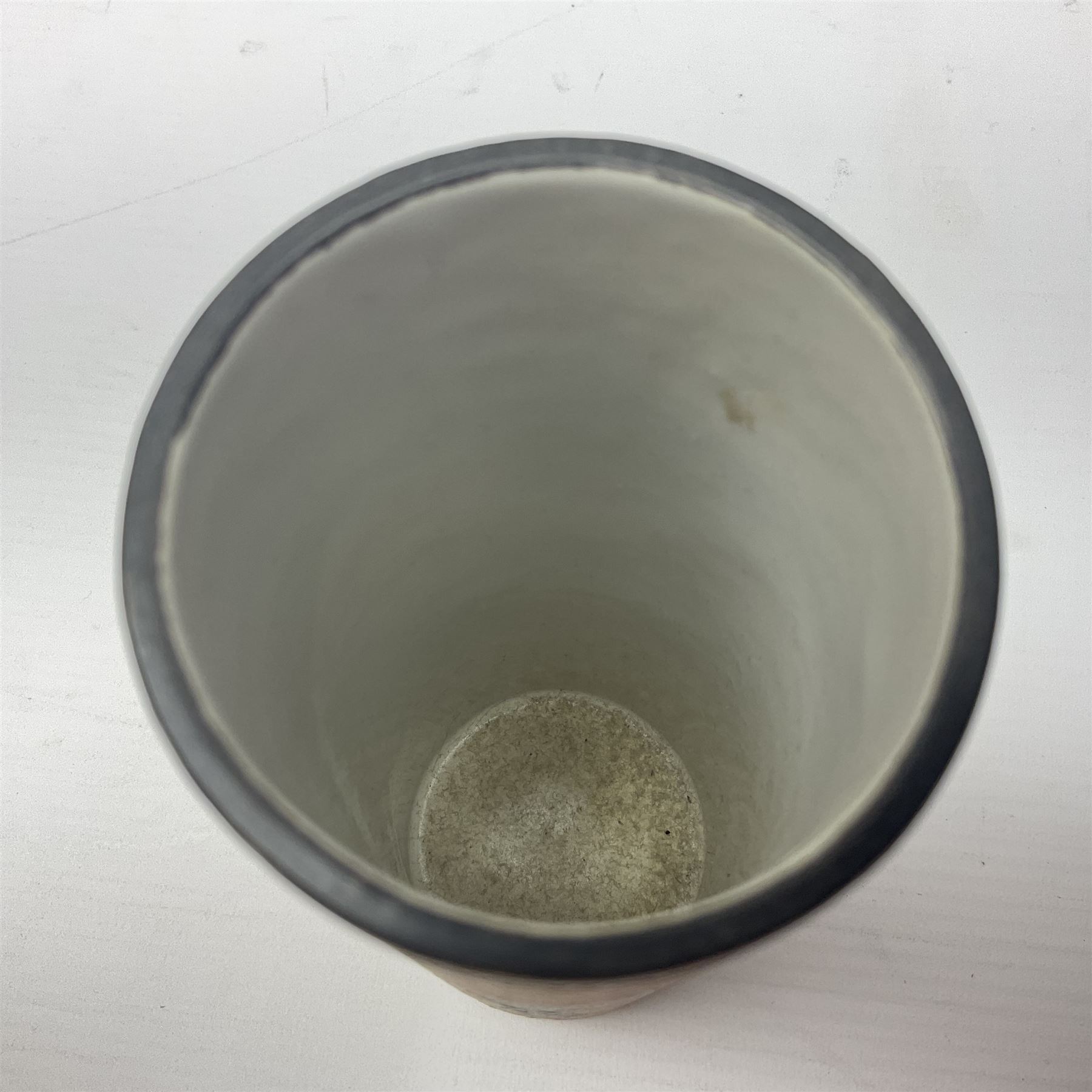 Troika cylindrical vase decorated with circles upon a striped backdrop, designed by Linda Taylor, with painted marks beneath, H14cm