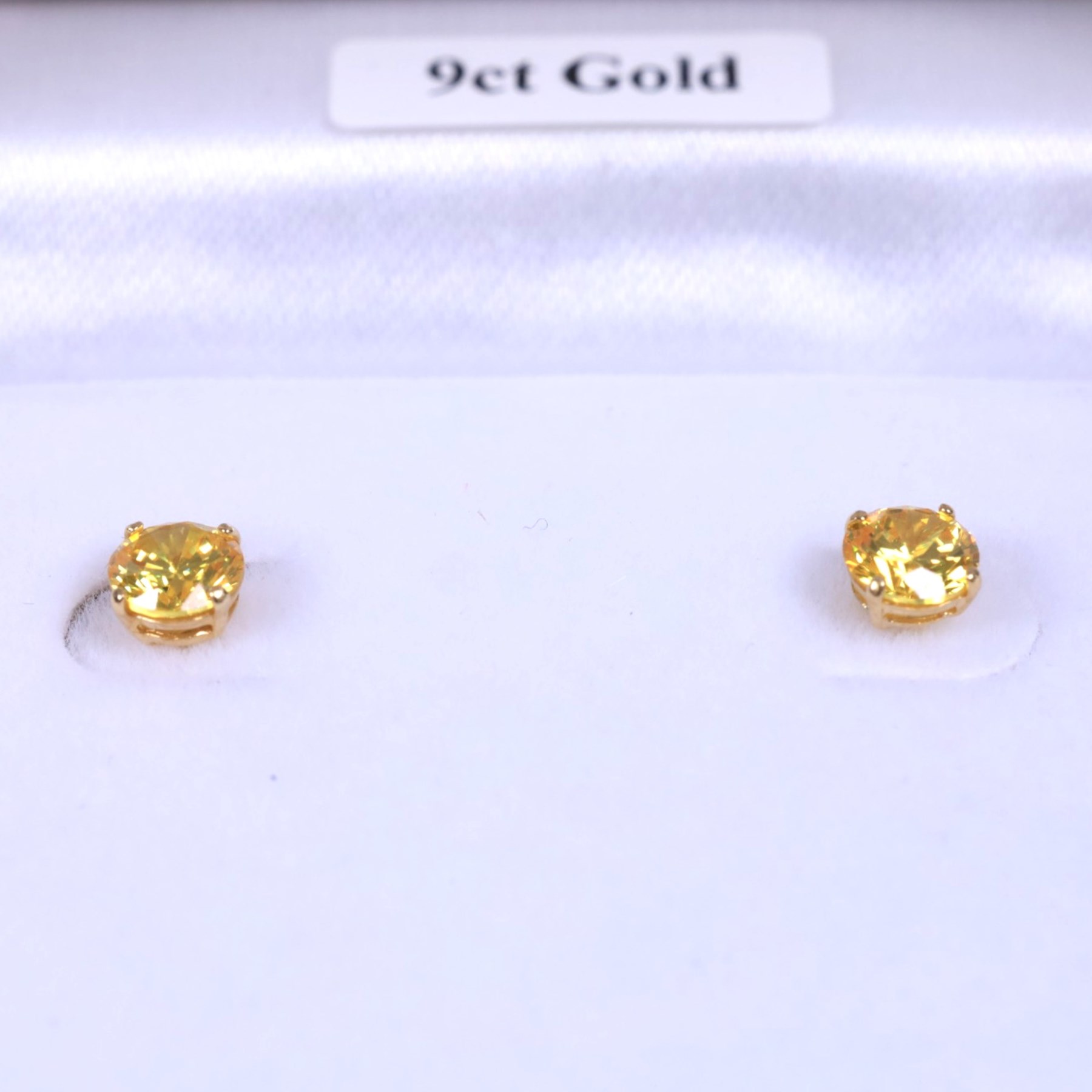 Pair of 9ct gold citrine stud earrings, boxed