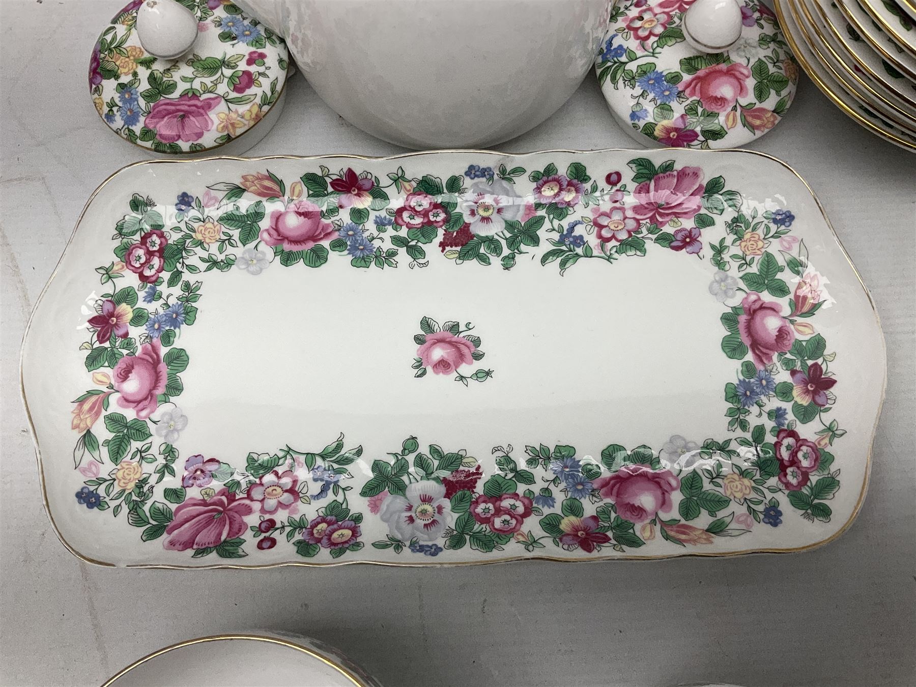 Crown Staffordshire Thousand Flowers pattern part tea service, to include teapot, two open sucriers, eighteen cups, fifteen saucers etc (57)