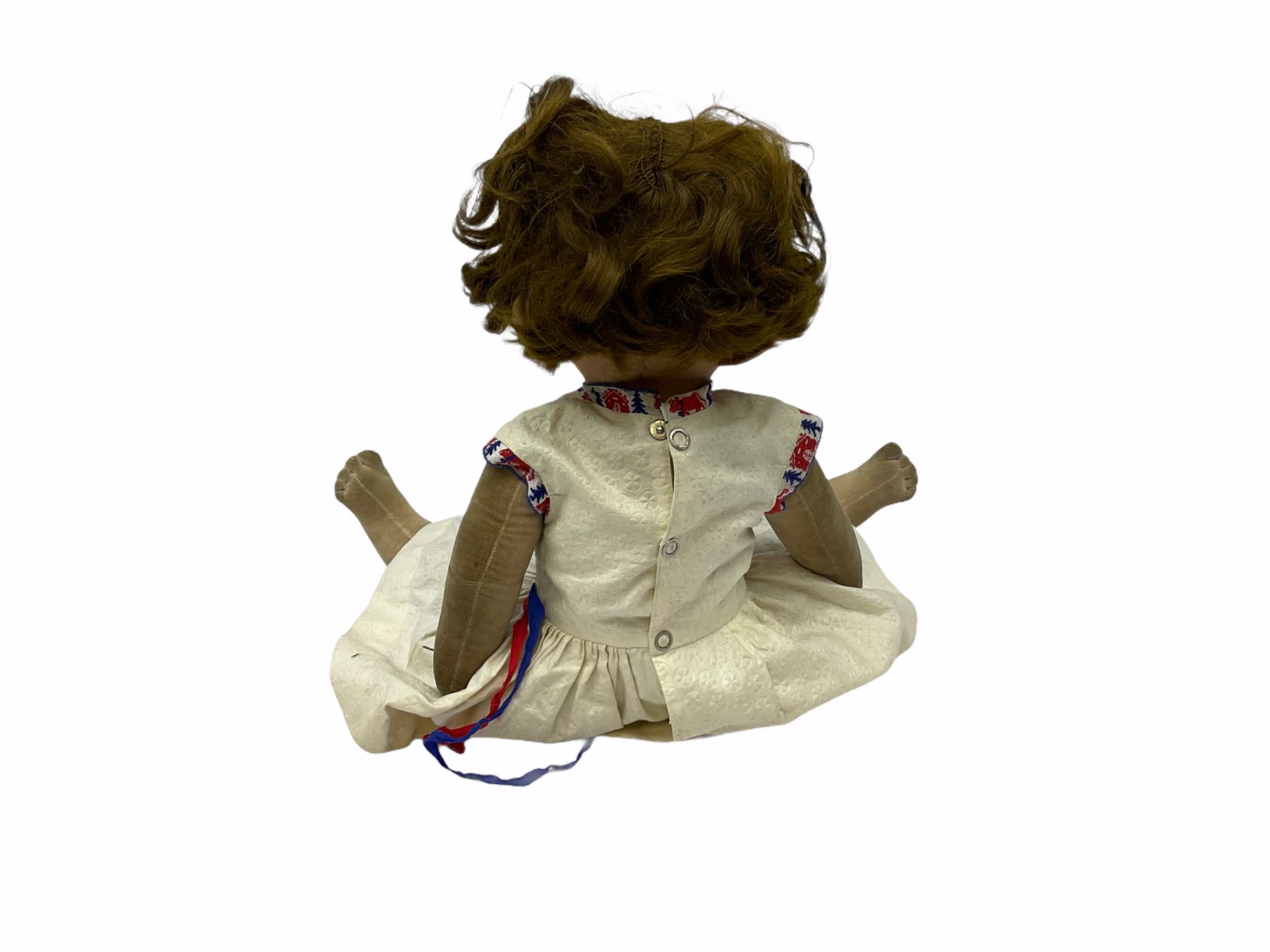 1920s Chad Valley 'Bambina' doll, the pressed felt head with applied hair, side glancing inset glass eyes, painted facial features and velvet jointed body, Hygenic and Bambina labels to the feet H46cm