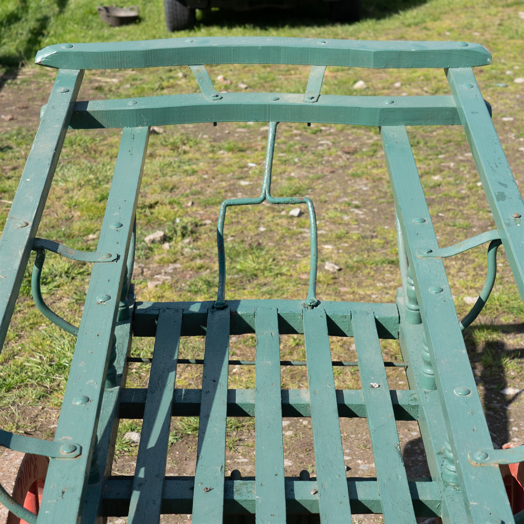 Costermonger’s Cart

A painted costermonger’s cart with green slatted timber body, red painted wooden spoked wheels and red leaf spring suspension. The cart is fitted with raised side rails, turned supports and short projecting handles. Painted lettering is visible along the side rails, together with the number “661” to the frame and wheel rim.
Finished in traditional colours, the cart offers excellent decorative appeal and would be suitable for display, garden or country house settings.

Dimensions:
Overall length: 240 cm
Body length: 215 cm
Width: 94 cm
Height: 86 cm
Wheel diameter: 64 cm

Features:
Timber construction
Open slatted carrying platform
Shaped side rails
Leaf spring suspension
Wooden spoked wheels
Iron tyres
Iron fittings throughout
Carved ownership and maker inscriptions
Traditional painted finish

