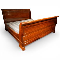 Victorian style mahogany super king sleigh bed with bases, shaped panelled headboard and footboard with scrolled ends, moulded side rails, raised on block supports with castors