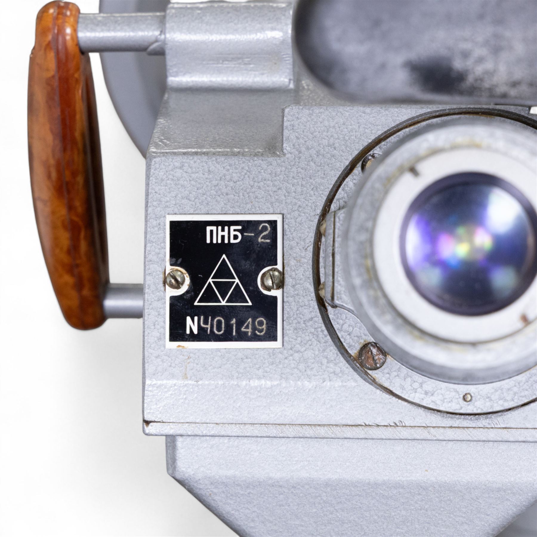 Pair of mid 20th century Russian Helios PNB-2 military observation binoculars, no. 40149, each 'Big Eye' lens 13cm in diameter, with 80 degrees vertical elevation, 360 degrees rotation, spirit level to centre of body, contained in wooden stow case with service manual, canvas cover, two lens caps, a small latched metal tin containing lenses and accessories and on adjustable wooden tripod painted green with pointed feet,  with a small latched metal tin containing eight lenses and accessories