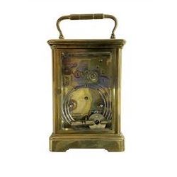 French - late-19th century 8-day carriage clock in a corniche case with matching handle, enamel dial with roman numerals, minute track and steel spade hands, subsidiary alarm setting disc in Arabic's, rack striking movement striking the hours, half hours and alarm on a coiled gong, with a jewelled lever platform escapement. With key.