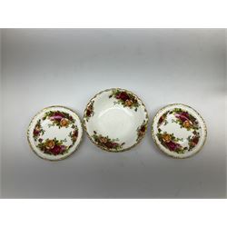 Royal Albert Old Country Roses part dinner and tea service comprising teapot, four tea cups and saucers, eight dessert plates, cake plate, cake stand, a tureen with cover, six dinner plates, an oval dish, two trinket dishes, bell and shoe decoration. 