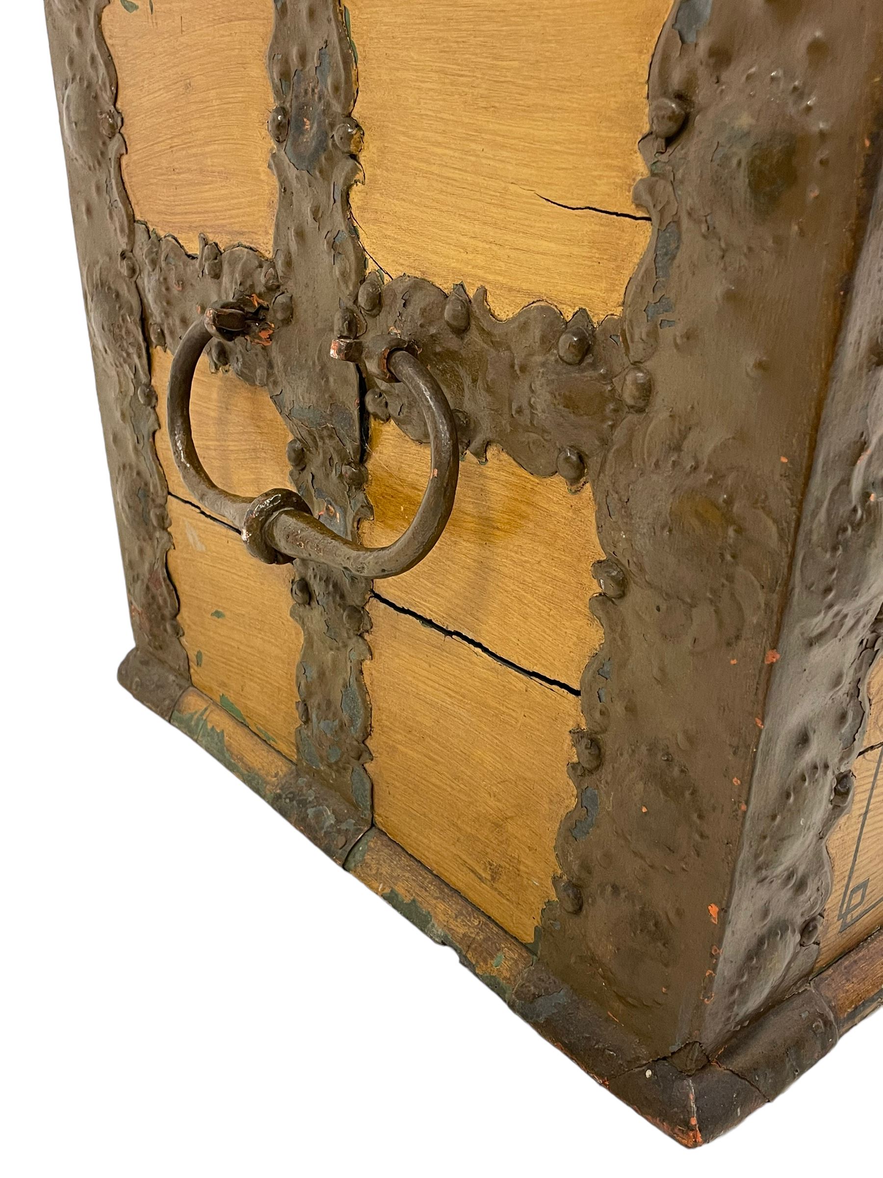 19th century painted oak sea chest, hinged dome top enclosing small compartment, bound by shaped and pressed metal strapwork, scumbled finish to resemble oak and painted with small vignettes depicting portraits and landscapes within panels, fitted with large wrought metal carrying handles, the front inscribed 'H.J.S. 1870' 