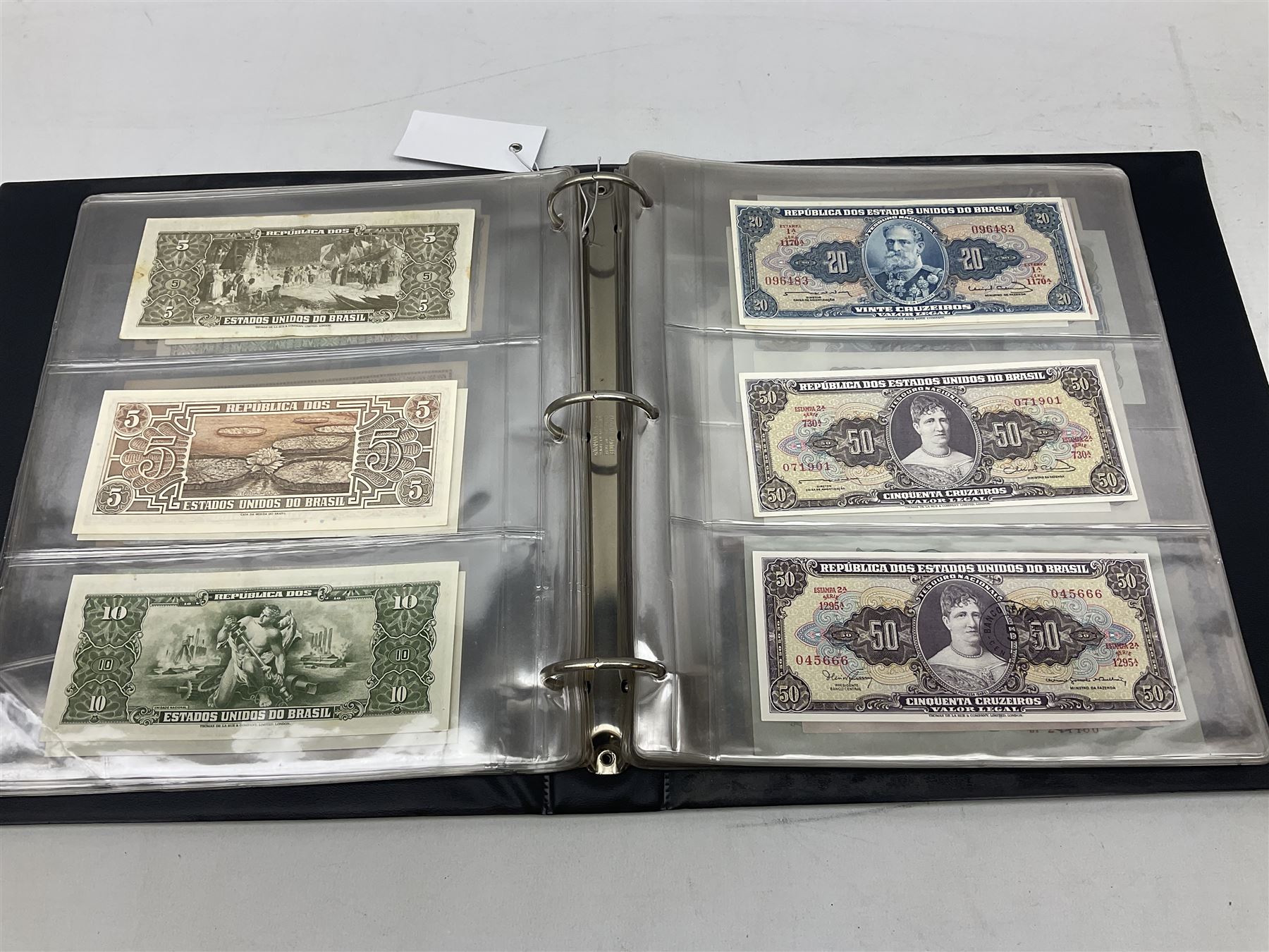 World banknotes, including Queen Elizabeth II The States of Jersey one pound 'DB202703', five pounds 'BB527762' and ten pounds 'AB651481', reserve bank of New Zealand two dollars '1L3 741894', King George V Straits Settlements one dollar 1st January 1935 'F/83 28924', various Bank of England notes etc, housed in two ring binder albums