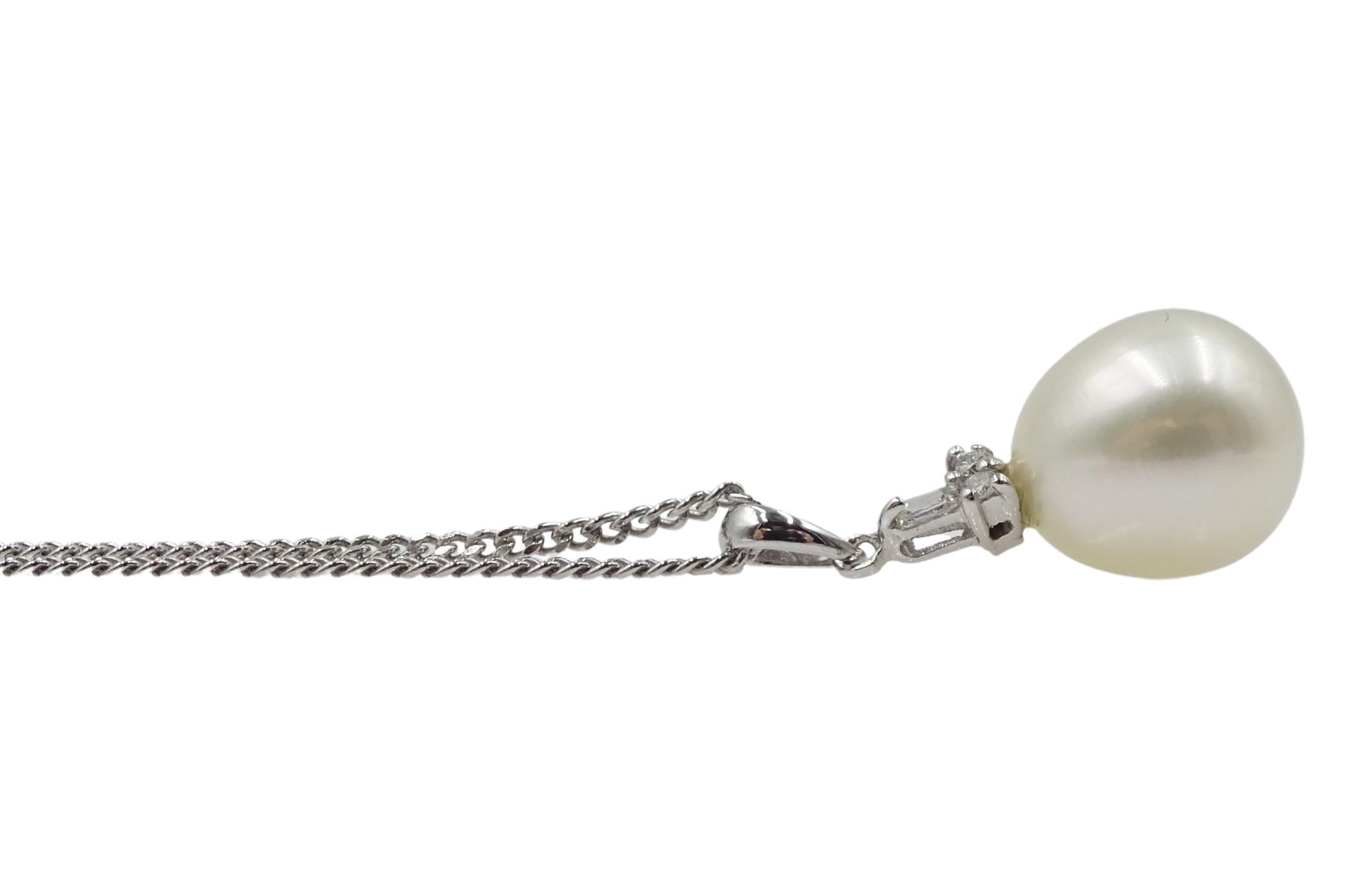 9ct white gold pearl and diamond pendant, stamped 375, on silver chain