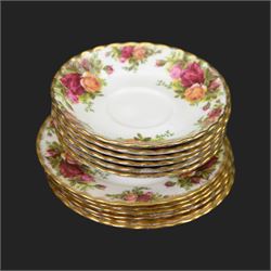 Royal Albert Country Roses tea and dinner service for six place settings, comprising teapot, milk jug, cups and saucers, dessert plates, side plates and dinner plates, all with printed mark beneath 