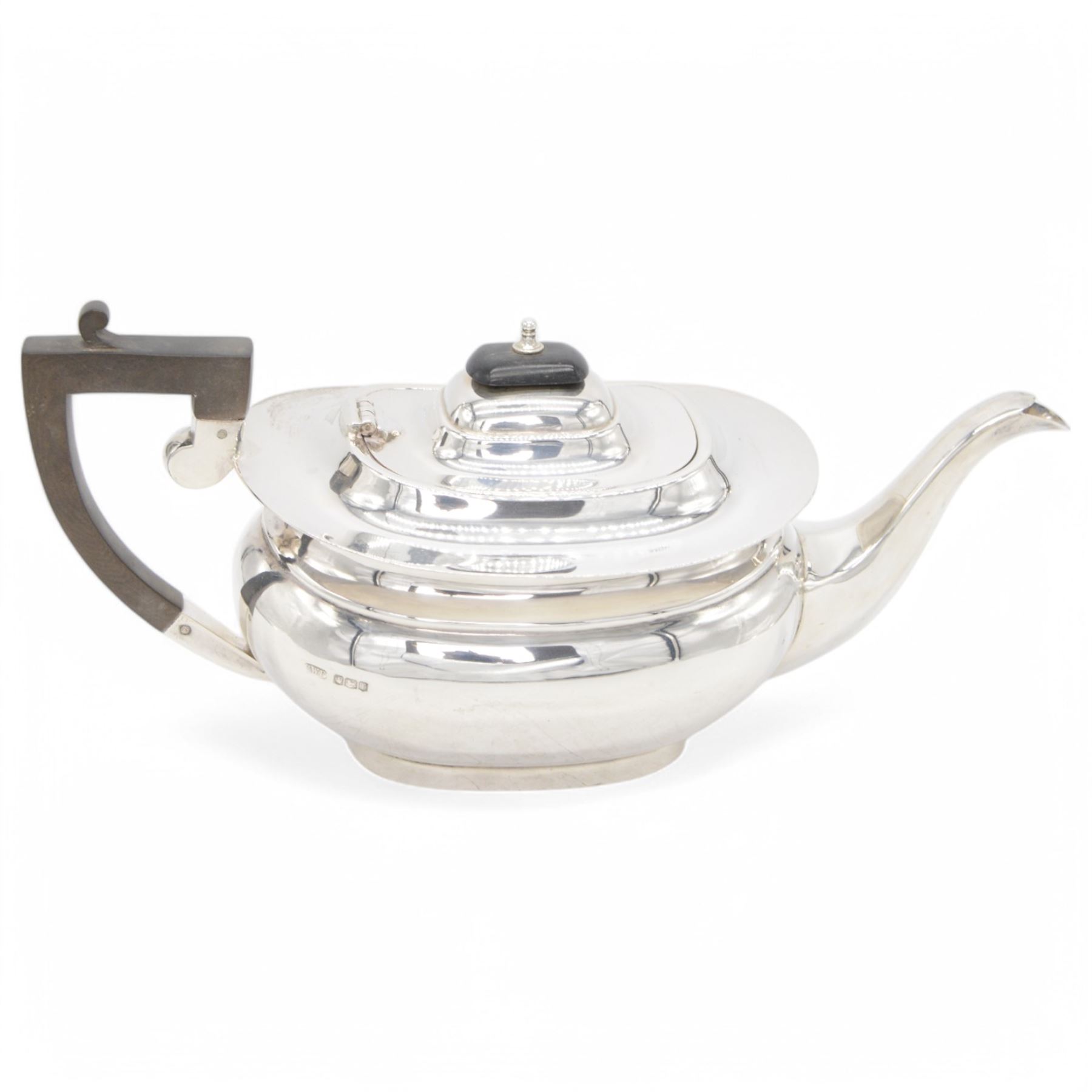 1920s silver tea pot, of oval bellied form, with Bakelite type handle and finial, hallmarked C W Fletcher & Son Ltd, Sheffield 1923, H15cm