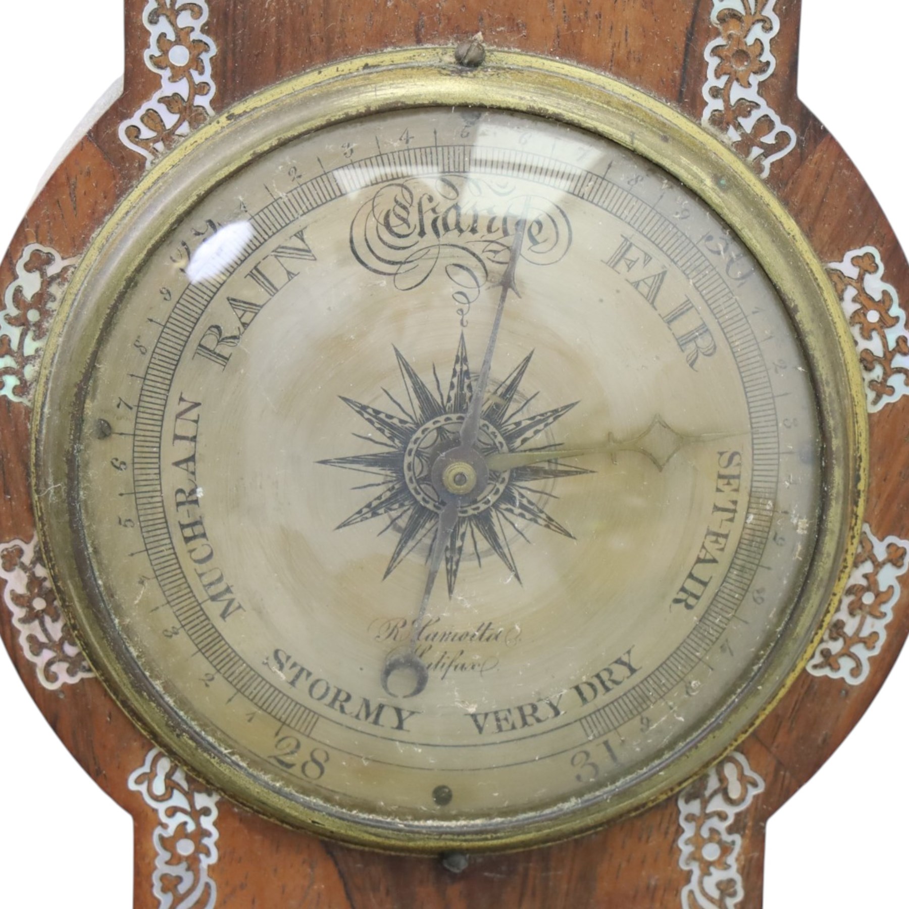 Three wheel barometers, a mother of pearl inlaid mahogany case, swan neck pediment, thermometer and circular dial, H 92cm, the second Sheraton Revival style with floral inlay, swan neck pediment, thermometer and circular dial, H 102cm, the third Sheraton Revival style, H 95cm (3)