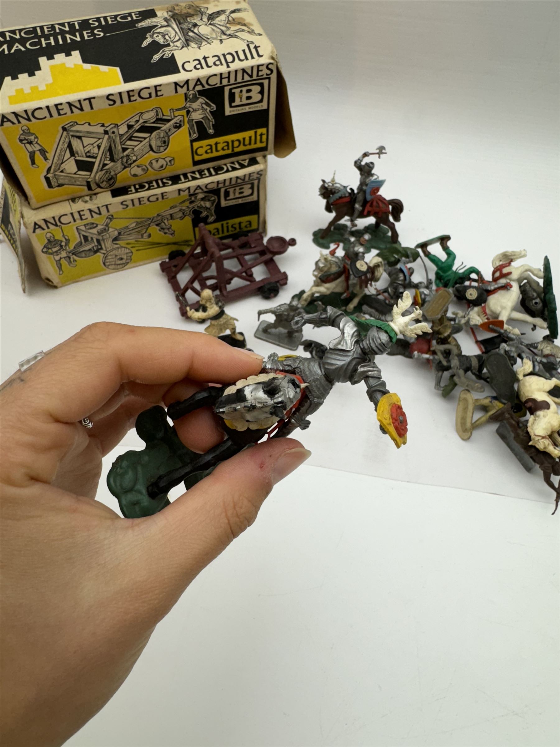 Two Britain's Ancient Siege Machines, comprising Balista and Catapult and a collection of plastic knights and soldiers, including Britains examples etc