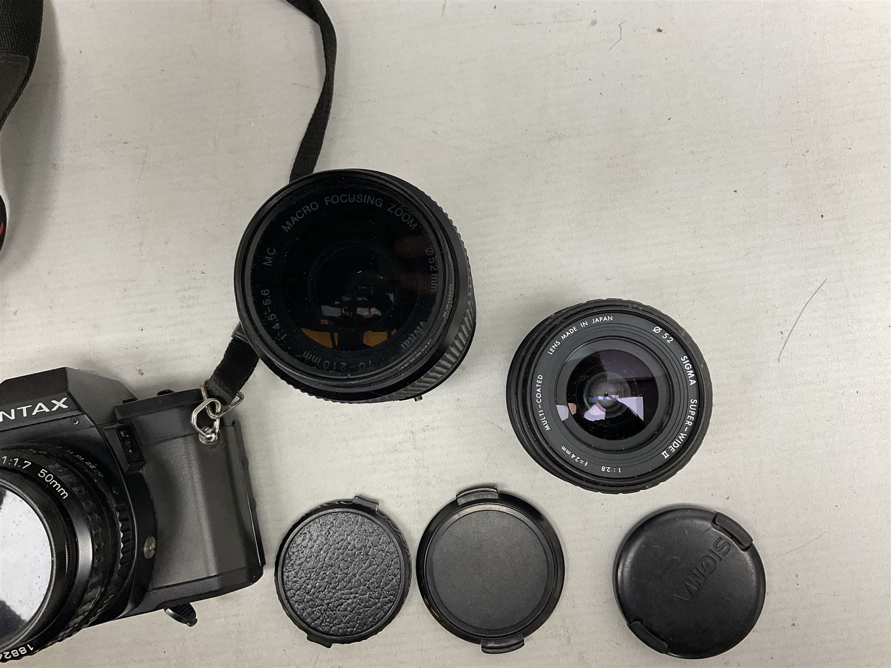 Pentax P30 SLR camera with SMC Pentax-A 1:1.7 50mm lens, Sigma Super-Wide II 1:2,8 lens and Vivitar 70-210mm lens