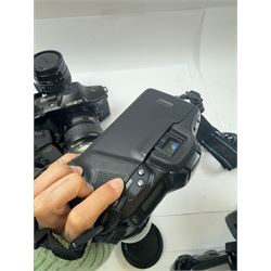 Six Minolta Dynax SLR camera bodies, comprising 800si serial no. 62703606, three 7xi examples, including one boxed example, serial nos. 20106944, 16123311 & 22107553, and two 9xi examples, serial no. 18209901 & 18202113, with three Minolta lenses, including Zoom xi 28-105mm 1:3.5(22)-4.5 lens, AF Zoom 28-85mm 1:3.5 (22)-4.5 lens and an AF Zoom 75-300mm 1:4.5(32)-5.6 lens, Hama carry case and other accessories