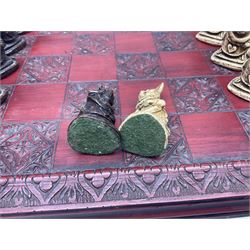 Alice in Wonderland themed chess set, with a complete set of composite figures, modelled as characters including Alice, Tweedledum and Tweedledee, the White Rabbit and the Mad Hatter, etc