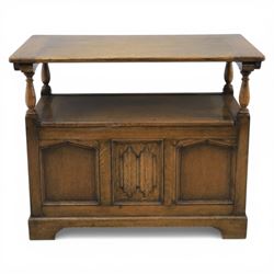 20th century oak monks bench with hinged box seat, with blind fretwork to the seat, panelled front and sides with linen fold panel in the centre