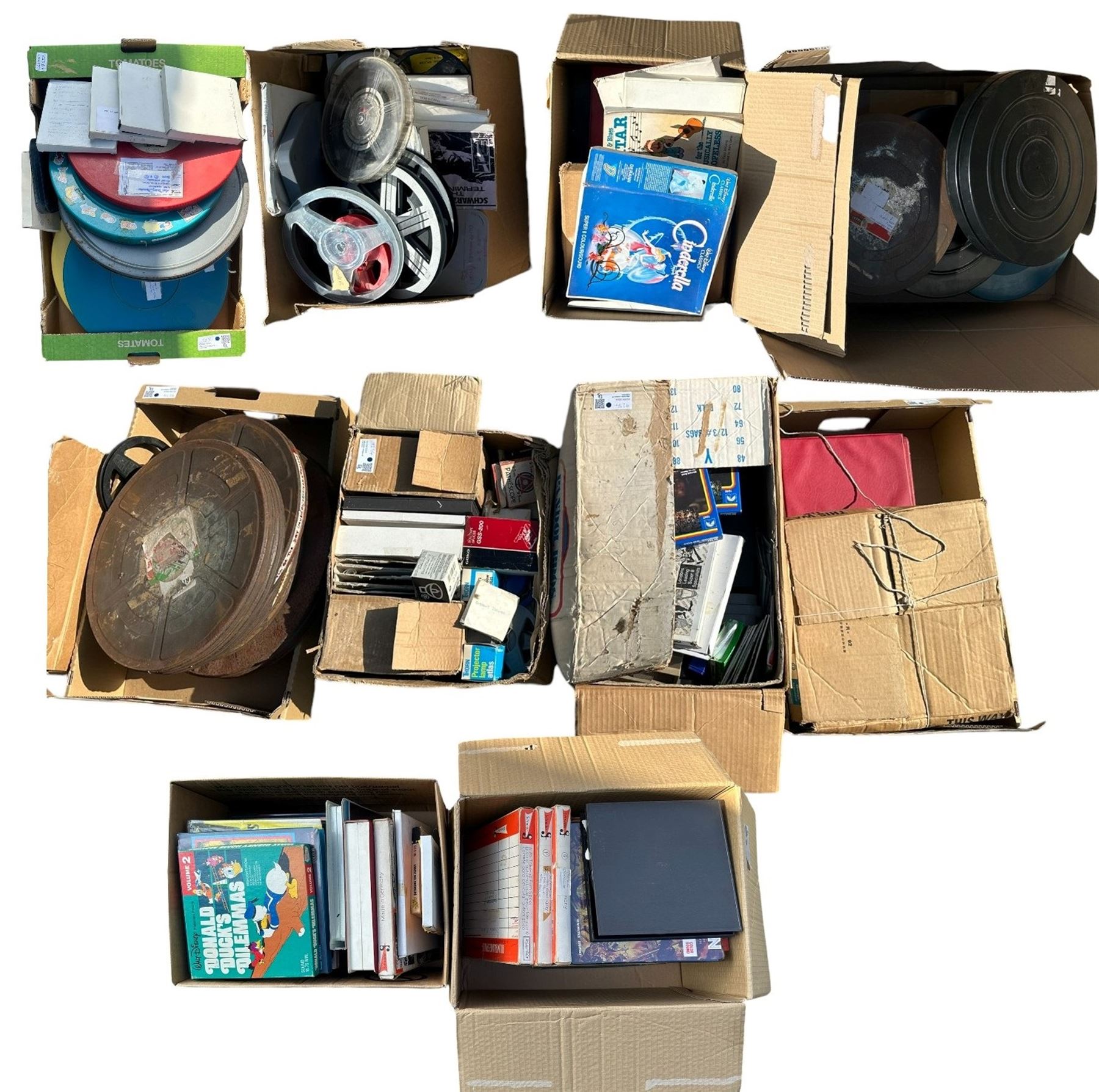 Large quantity of home cinema reels including 8mm & 18mm reels, Walt Disney movies, roll tape slicer, projector lamp and other reels and accessories in ten boxes