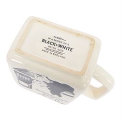 Eight Black and White Scotch Whisky advertising jugs