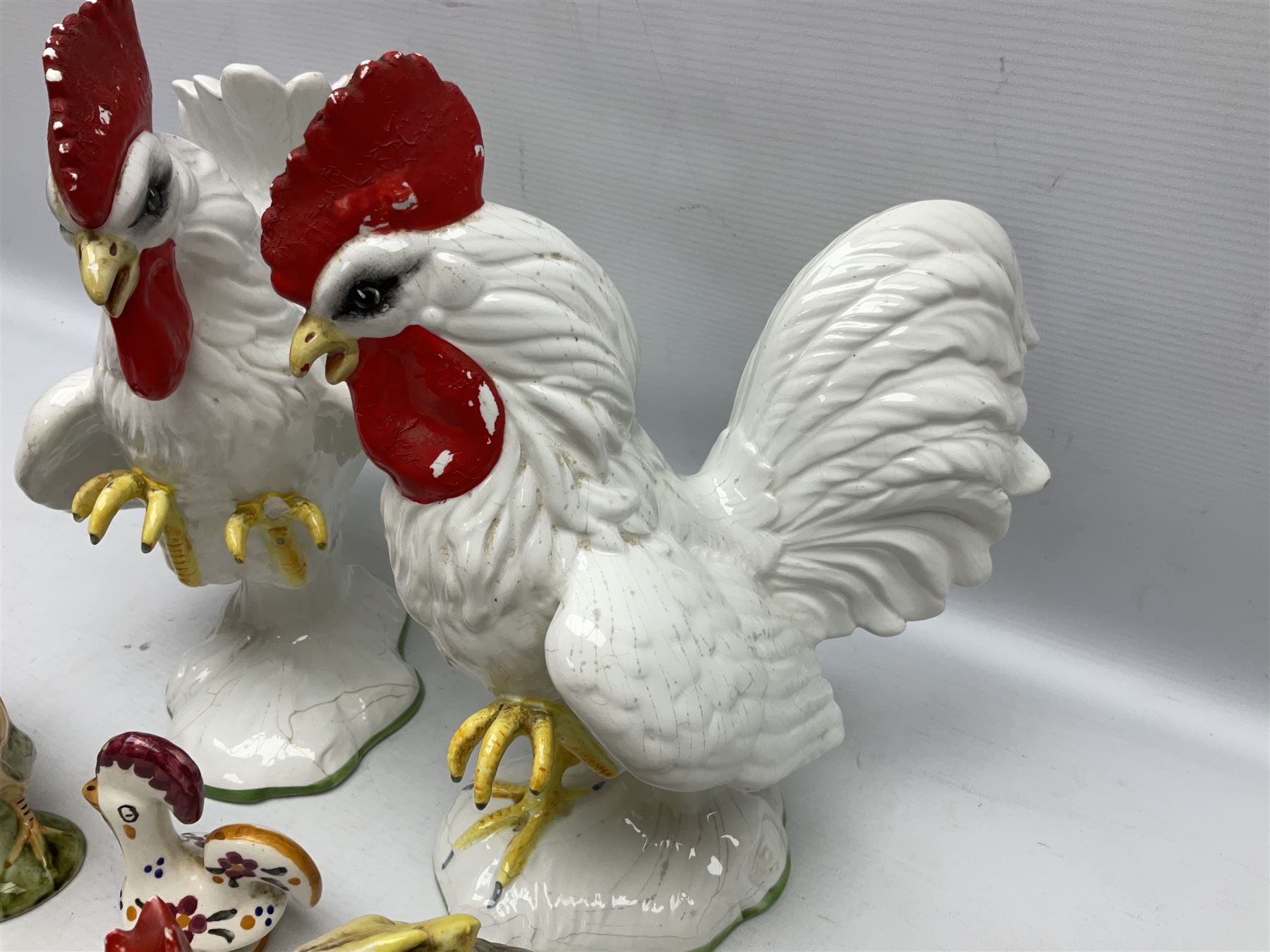 Pair of fighting cockerels from Italy together with three other ceramic cockerels, largest H30cm 