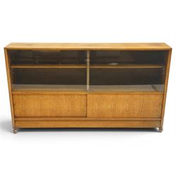 Herbert E Gibbs - Mid 20th century teak bookcase with sliding glazed doors, glazed upper s...