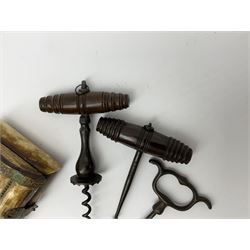 Two corkscrews with turned wood handles, together with another corkscrew and a panelled bone box with pierced decoration, L10cm