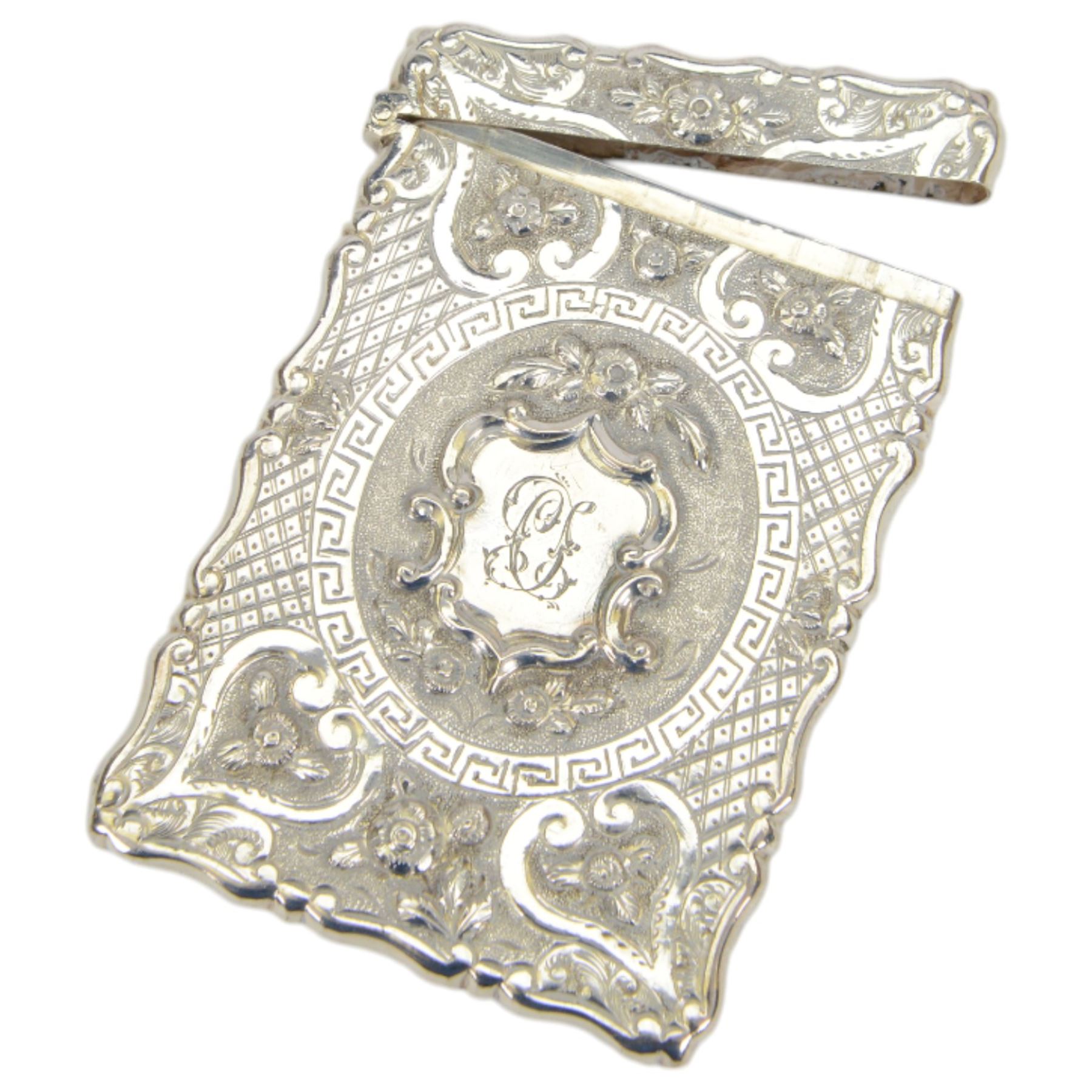 Victorian silver card case, of rectangular form with shaped borders, relief embossed with fruit and flowers and engraved with monogram, hallmarked George Unite & Sons, Birmingham 1875, H9.5cm, contained within fitted tooled leather case