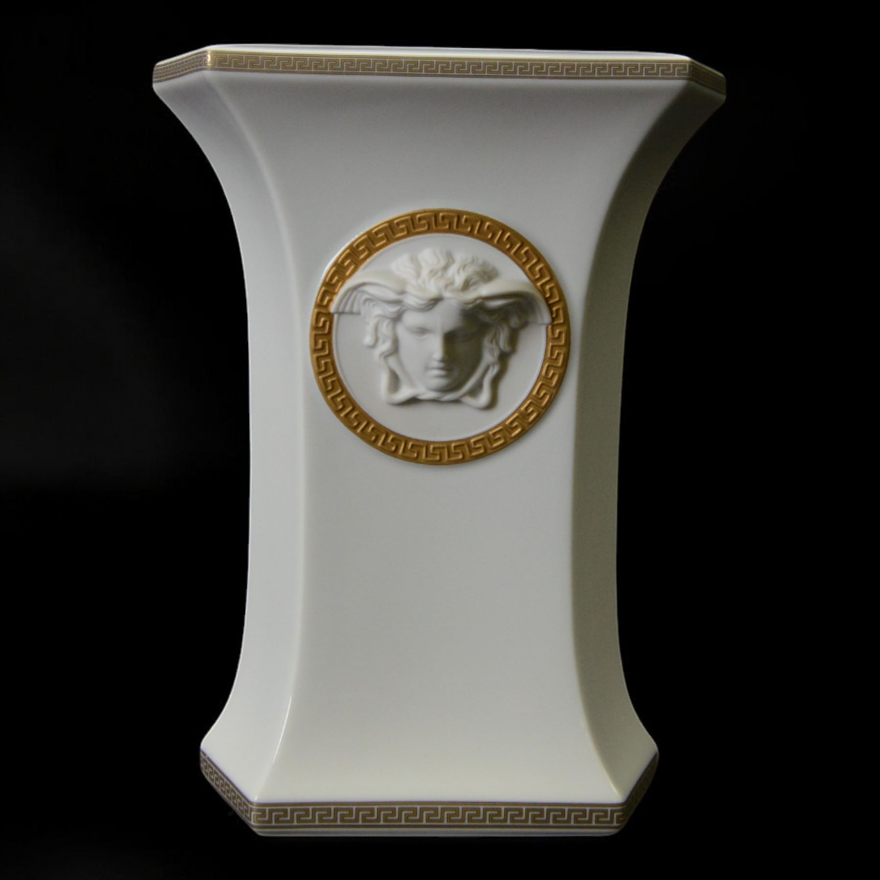 Rosenthal Versace Gorgona vase, of rectagular form with fluted base and rim, decorated in relief with medusa masks and gilt greek key borders upon a white ground, boxed, H23cm