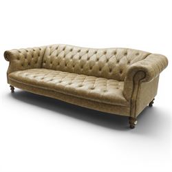 Tetrad - 'Matisse' grande three-seat sofa, Chesterfield shape with rolled arms flanking a serpentine back and front, upholstered in buttoned tan leather with close-nailed studwork, on turned feet