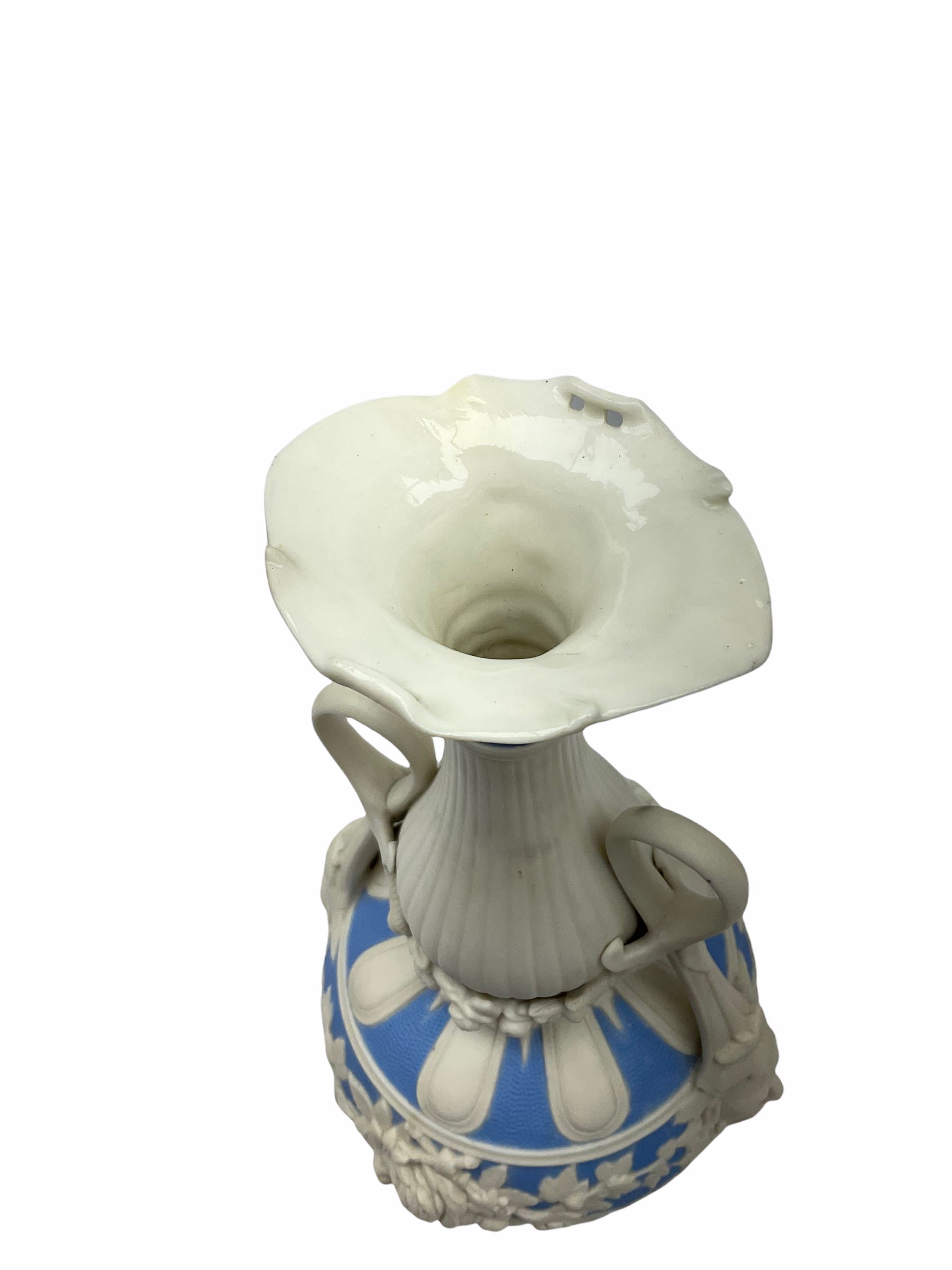 Victorian Parian ware twin handled vase detailed with Bacus masks fruiting vines and floral sprays H36cm, together with a Parian jug H14.5cm, classical Parian sculpture H40cm, decorative plaque decorated in high relief depicting two children D18.5cm. 