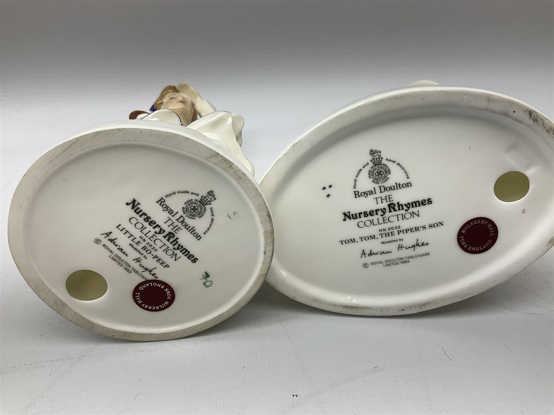 Seven Royal Doulton figures from the Nursery Rhymes Collection comprising, Tom Tom, the piper's son HN3032, Little Jack Horner HN3034, Wee Willie Winkie HN3031, Polly, put the kettle on HN3021, Little Bo-peep HN3030, Little Boy Blue HN3035, Little Miss Muffet HN2727, together with two Royal Doulton Mary had a little lamb figures HN2048 and COPR1948, all with printed marks beneath  