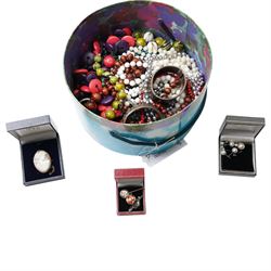 Two silver hinged bangles, 9ct gold mounted shell carved cameo brooch, badges, beaded necklaces etc