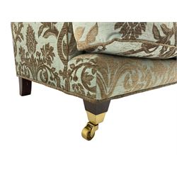 Wade - 'Kempston' three seat sofa, upholstered in chenille fabric with brocade pattern, raised on mahogany finish square tapering block feet with heavy brass castors