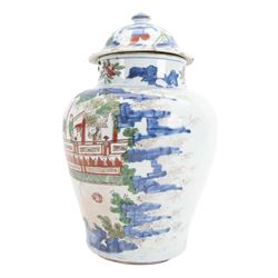 17th century Transitional period Chinese Wucai vase and cover, of baluster form, the body painted with ladies upon a terrace, and figures upon horseback and attendants within a fenced garden, the domed cover with knop finial painted with boys at play, H37cm
