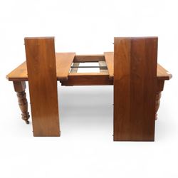 Victorian mahogany extending dining table, rectangular top with chamfered corners above a plain frieze raised on turned reeded legs with castors and two additional leaves, 197cm fully extended, and a set of six early 20th century oak upholstered chairs with drop-in seats, arched panelled back splat and close studded border on turned front legs joined by stretchers, 47x41x109cm 
