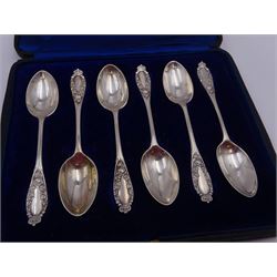 Set of six late Edwardian silver coffee spoons, each with embossed floral decoration and crown finials, hallmarked Josiah Williams & Co, London 1910, together with a modern silver cutlery set, comprising knife, fork and spoon, hallmarked Lee & Wigfull, Sheffield 1960, both contained within tooled leather fitted cases