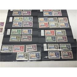 King George V 1910-1935 Silver Jubilee stamps, including Antigua, Basutoland, Cayman Islands, Fiji, Nyasaland, Jamaica, St Helena, Seychelles, Swaziland, St Lucia, British Guiana etc, housed on pages and stockcards 