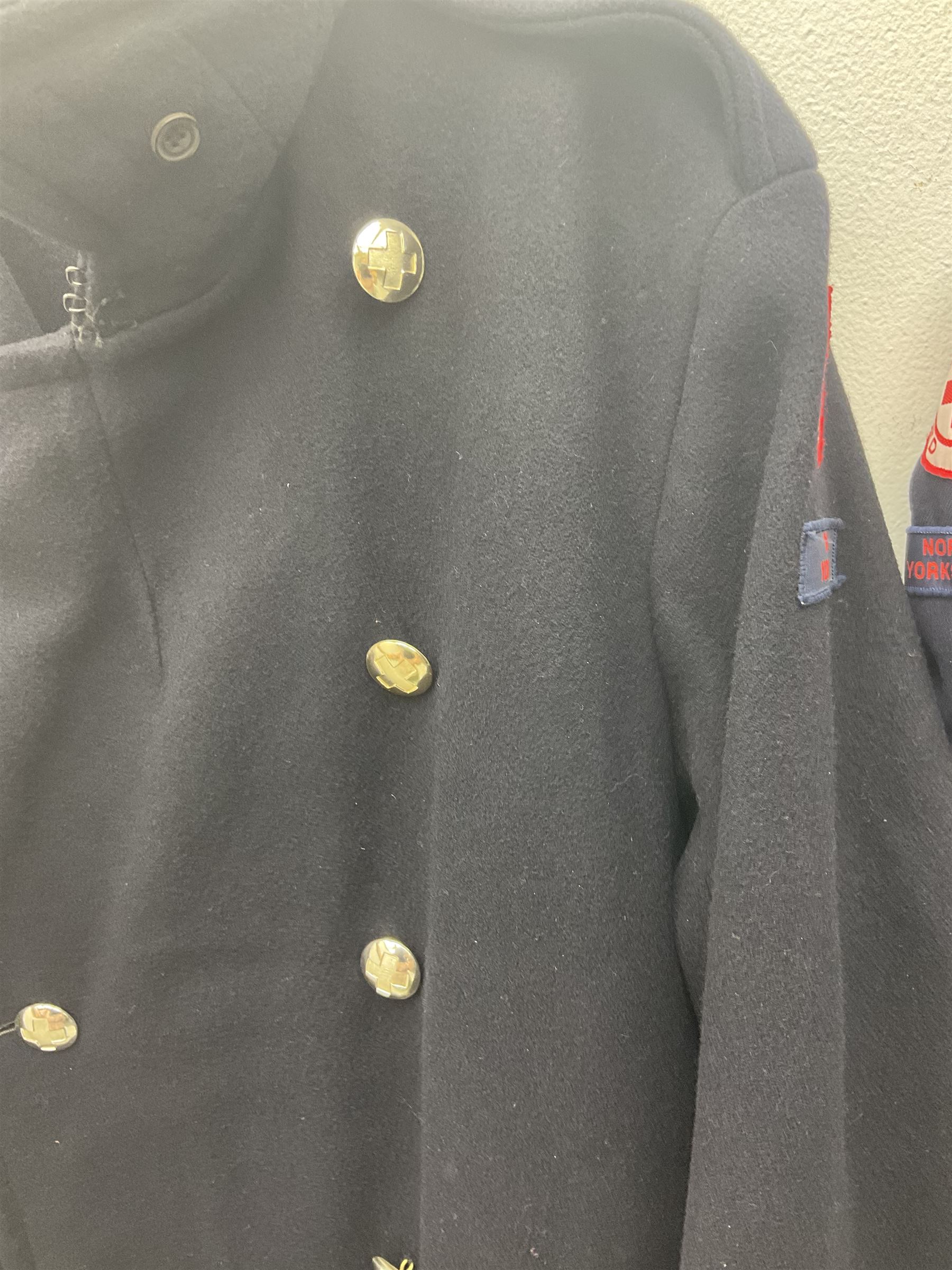 1950s British Red Cross North Yorkshire dress uniform comprising tunic, trousers, greatcoat and visor cap; bears manuscript label '1956 Ware'