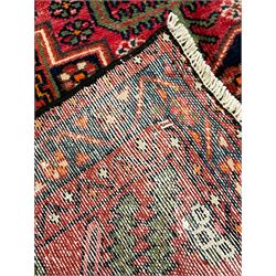 Persian Farahan rug, red and blue ground, the field divided into section with stylised flower head decoration, repeating border with overall floral design