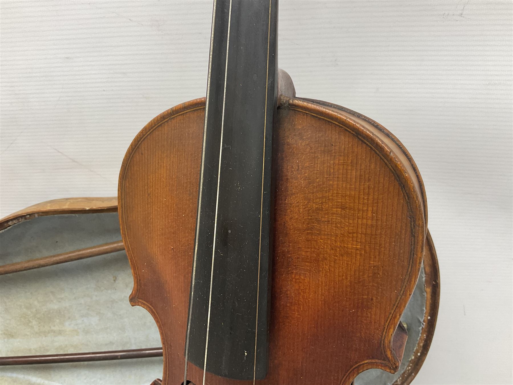 Mid-19th century German violin with 36cm two-piece maple back and ribs and spruce top, bears label 'Riccardo Antoniazzi Cremonese fece in Milano l'anno 1896' L59.5cm overall; in walnut case with two part bows