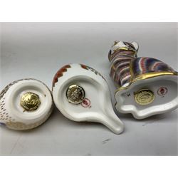 Three Royal Crown Derby paperweights, comprising seated cat and goldcrest both with gold stoppers, and robin with silver stopper, all with printed marks beneath, two with boxes, tallest H13cm