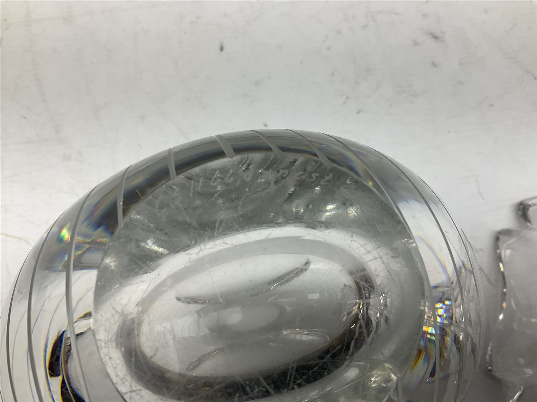 Two Orrefors Art Glass clear glass vases, the first example of compressed circular form, the second of tapering form with lobed rim, each signed beneath, tallest H14.5cm