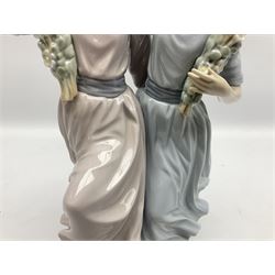 Lladro figure, Spring Dance, modelled as two girls beneath a flower arch, sculpted by Vincente Martinez, with original box, no 5069, year issued 1980, year retired 1981, H39cm