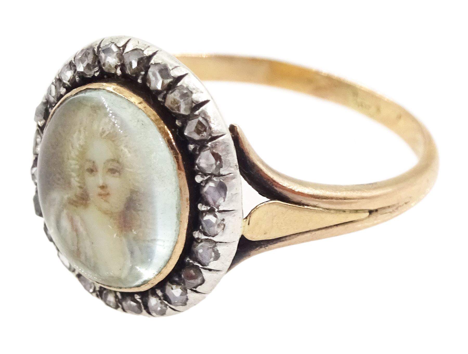 19th century French 18ct gold and silver diamond portrait ring, set with an oval miniature of a woman in 18th century dress on ivory, under a glazed panel, with rose cut diamond surround and trifurcated shoulders, hallmarked. This lot has been registered for sale under Section 10 of the APHA Ivory Act