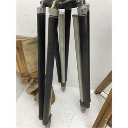 Three wooden adjustable tripods for plate cameras, together with a Linhof of Munchen metal tripod in a canvas case 