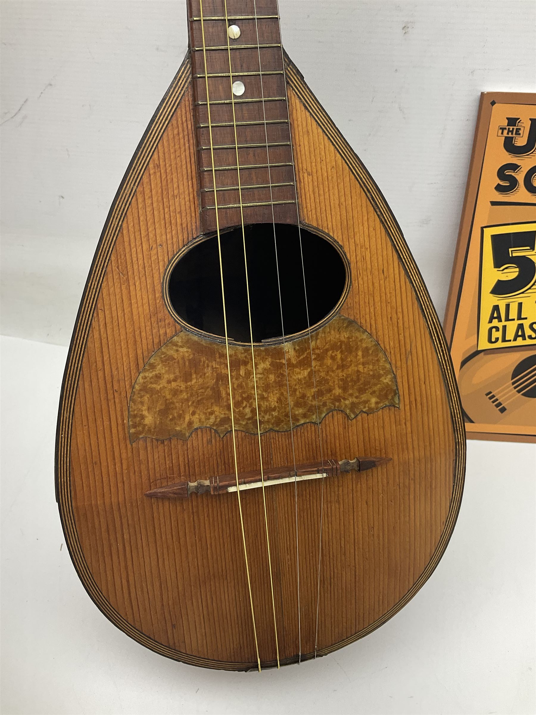 W.D. Keech banjolele pat.219720/23 with etched signature to the back; serial no.A12082 L55cm; and a restored Italian mandolin with segmented lute back; together with three music books