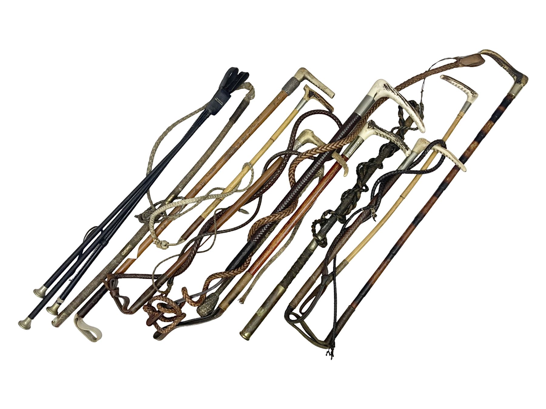 Collection of hunting crops and riding whips, including horn handle examples with silver cuffs