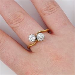 Gold diamond ring, crossover set with two old cut diamonds, stamped 18ct, total diamond weight approx 1.30 carat